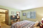 Primary Bedroom has a Flat Screen TV, Bath and Walk in Closet